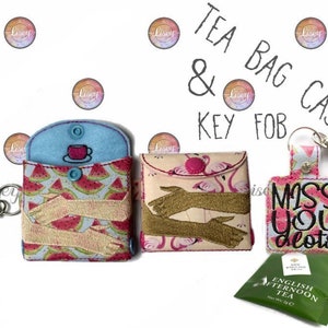 May include: Two tea bag cases with key fobs. One case is blue with a watermelon print and the other is pink with a flamingo print. The key fobs have embroidered designs that say "Miss You Lots".