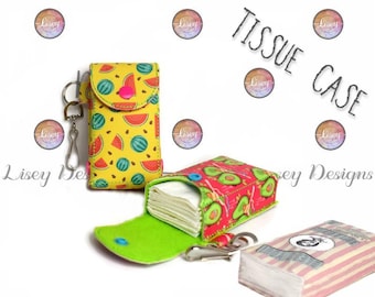 May include: Two fabric tissue cases. One is yellow with a watermelon pattern, the other is red with an avocado pattern. Both have a snap closure and a key ring. The text "TISSUE CASE" is in the background.