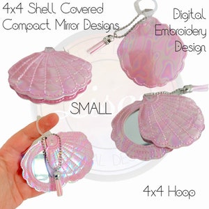 May include: A set of three pink iridescent shell-shaped compact mirrors with a tassel charm. The mirrors are designed for a 4x4 hoop embroidery machine.  The mirrors are small and compact, perfect for carrying in a handbag or pocket.