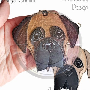May include: A digital embroidery design of a Bullmastiff dog's head, in brown and black, for a 4x4 hoop.