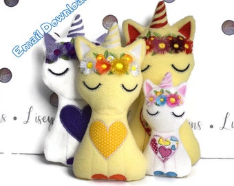 May include: A set of three plush unicorn toys with embroidered floral crowns and hearts. The unicorns are yellow, white, and white with pink accents.