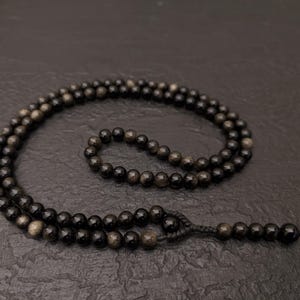Mala 108 pietre naturali ossidiana nera e 7 chakra - La Fenice Indaco Mala 108 pietre naturali ossidiana nera e 7 chakra - La Fenice Indaco