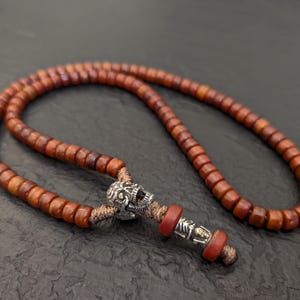 Old vintage yak bone mala necklace rosary 108 prayer beads, natural Tibetan aged orange yak bone, silver skull and stylized skeleton pendant