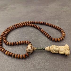 Tibetan Juniper Mala Prayer Buddhist Necklace 108 Meditation Beads and Little Buddha Wooden Pendant in Lotus Jewelry