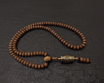 Collana Mala tibetana con semi di Bodhi, 108 grani da preghiera e ciondolo a forma di ruota rotante buddista.