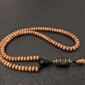 Tibetan juniper mala necklace rosary 108 prayer beads and prayer wheel pendant Om Mani Padme Hum mantra inside