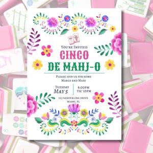 Peut inclure: Une invitation blanche avec des motifs floraux à l'aquarelle et le texte "Cinco De Mahj-O". L'invitation comprend la date, l'heure et le lieu de l'événement. Le design présente des couleurs rose, violet, jaune et vert.