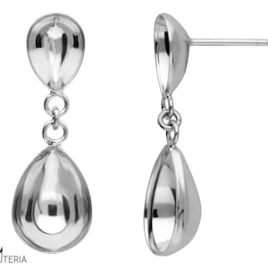 May include: A pair of silver drop earrings. Each earring has a teardrop shape, with a smaller teardrop connected above the larger one by small circular links. The earrings have a polished, reflective surface, reflecting light.