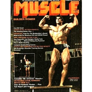 May include: Vintage magazine cover featuring a muscular man flexing, with the title "MUSCLE" in large orange letters. The cover includes text about bodybuilding and Lou Ferrigno. The magazine is dated July 31:00.