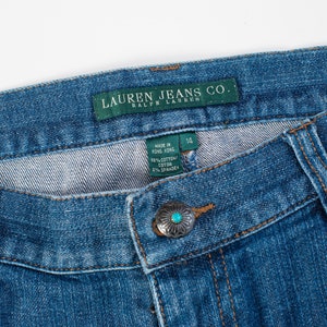 May include: Blue denim jeans with a green label that reads "Lauren Jeans Co. Ralph Lauren" and a size tag that reads "14". The jeans have a turquoise button and a turquoise and white beaded embellishment.