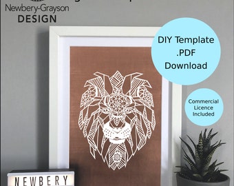 May include: A digital download template for a geometric lion design. The template is in PDF format and includes a commercial license. The image shows a white lion design on a brown background, framed and displayed on a shelf with a light box that reads "Newbery Grayson Design".