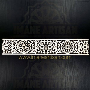 May include: White decorative laser cut wood panel with an intricate geometric pattern. The panel features a repeating design of floral motifs and circular elements. The text "www.imaneartisan.com" is printed below the panel.