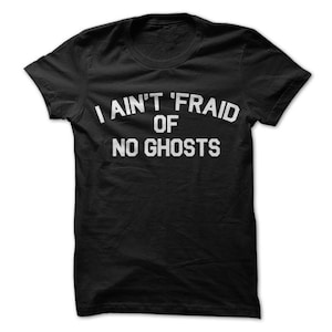 May include: Black t-shirt with white text that reads "I ain't 'fraid of no ghosts."