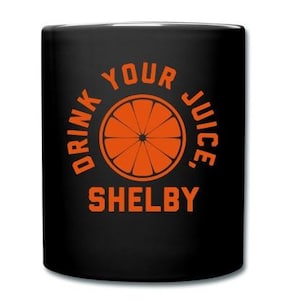 Drink Your Juice, Shelby Coffee Mug - Black Mug with Orange Print