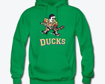 May include: Green hooded sweatshirt with a cartoon duck wearing a hockey uniform and holding a hockey stick. The text "DUCKS" is printed in yellow and purple below the duck.