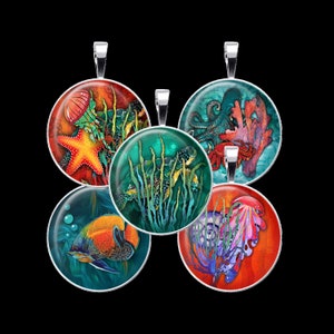 May include: Five round pendants with silver chains, each featuring a different underwater scene. One pendant shows a starfish, jellyfish, and seaweed, another shows a turtle swimming in seaweed, another shows an octopus with coral, another shows a fish, and the last shows a jellyfish with seaweed.
