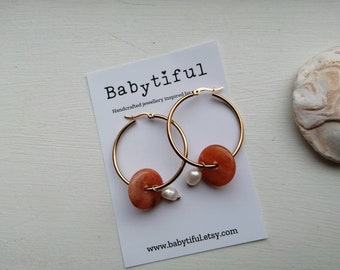 Stylish earrings with freshwater pearls and natural stone