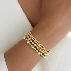 14k Dainty Gold Beaded Bracelet. Dangling Gold Bead Bracelet