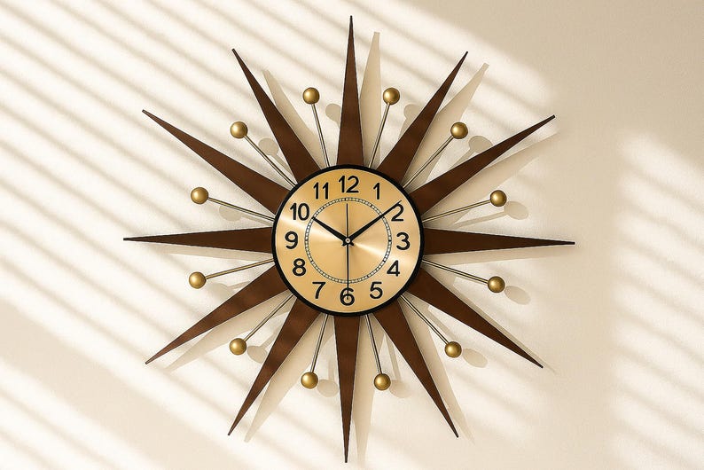 May include: A starburst wall clock with a gold-tone face and black numerals. The clock has brown wooden rays extending outward, with gold-colored spheres at the tips. The clock hands are black. A decorative piece for any room.