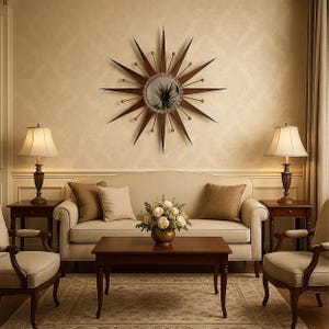 May include: A living room scene featuring a starburst mirror, a beige sofa with brown pillows, and two matching armchairs. Two lamps flank the sofa, and a coffee table sits in front. A bouquet of white flowers adds a touch of elegance.