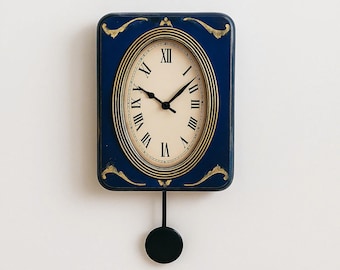 Vintage Wall Piece with Pendulum Blue Retro Oval Timepiece  Roman Numeral Decor