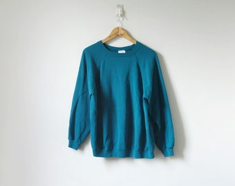 teal blue sweatshirt