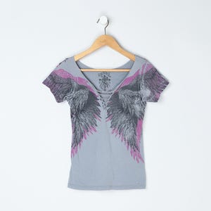 Vintage Y2k "Rebel Saints" Rhinestoned Angel Wings Graphic Tee with Latticed Neckline - 2000s clothing, gothic, gray, grey - Women's M