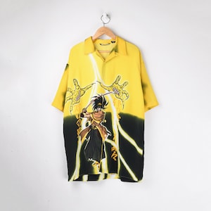 May include: A yellow button-up shirt with a black and white graphic print of a samurai warrior with lightning bolts and Japanese characters.