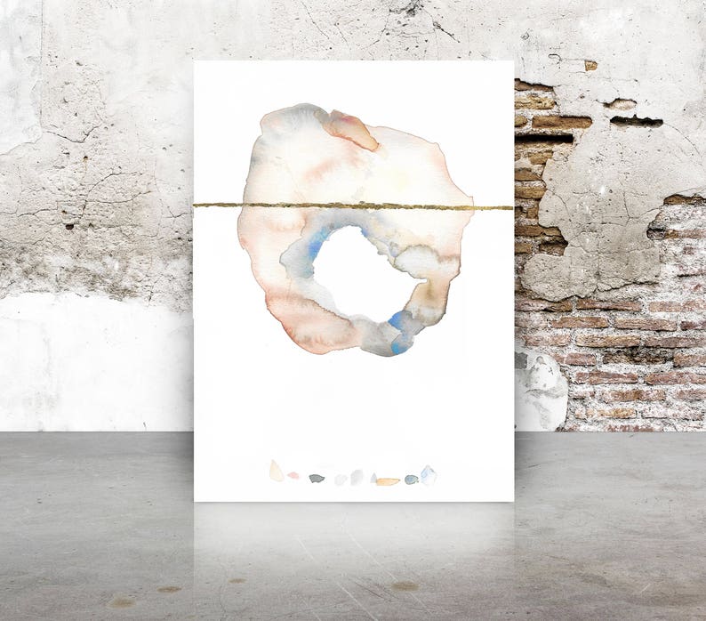 May include: Watercolor abstract art print featuring a central organic shape in muted tones of peach, blue, and gray, bisected by a thin gold line. The artwork is displayed on a white background, with a collection of small, colorful shapes at the bottom.