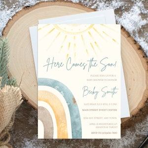 May include: A baby shower invitation featuring a watercolour rainbow and sun design. The text reads "Here Comes the Son!" and includes details for the event, including the date, time, location, and RSVP information.