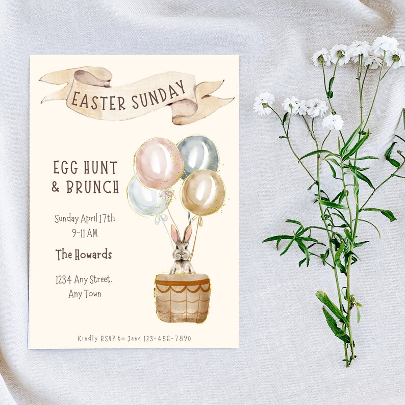 May include: An invitation to an Easter Sunday egg hunt and brunch. The invitation features a watercolor illustration of a bunny in a hot air balloon with pastel colored balloons. The text reads "Easter Sunday", "Egg Hunt & Brunch", "Sunday April 17th", "9-11 AM", "The Howards", "1234 Any Street", "Any Town", and "Kindly RSVP to Jane 123-456-7890".
