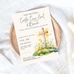 May include: A light beige invitation card with a watercolor illustration of a wooden cross surrounded by flowers. The text reads "Hop on over. Easter Egg Hunt & Brunch. Please join us to celebrate the holiday. Sunday April 9th, 2023. 11AM-3PM. The Smith's. 1234 Main Street. Any Town, Any State. Kindly RSVP to Sam (123)456-7890. Sampleemail@gmail.com"