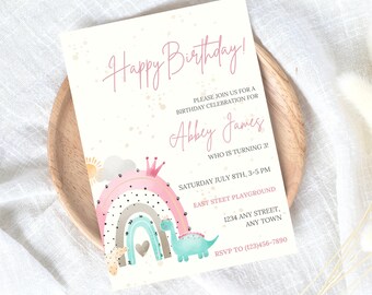 May include: A pink and white birthday invitation with a rainbow, a dinosaur, and a crown. The text reads "Happy Birthday!" and "Abbey James is turning 3".
