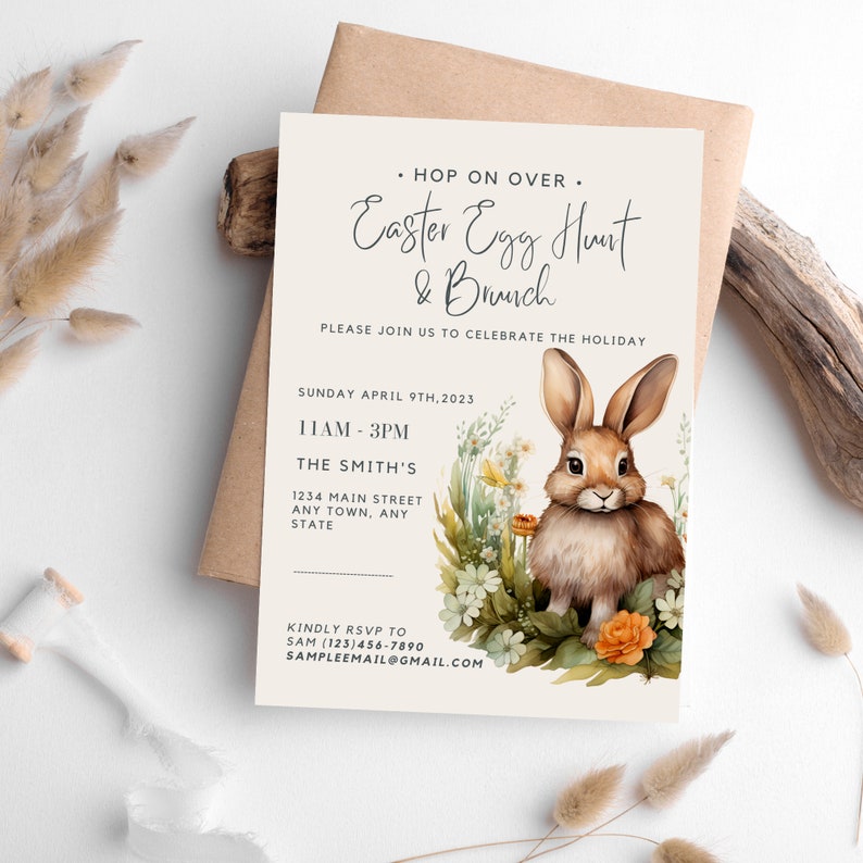 May include: An invitation to an Easter Egg Hunt and Brunch. The invitation features a watercolor illustration of a brown bunny rabbit in a field of flowers. The text reads "Hop on Over. Easter Egg Hunt & Brunch. Please join us to celebrate the holiday. Sunday April 9th, 2023. 11AM-3PM. The Smith's. 1234 Main Street. Any Town, Any State. Kindly RSVP to Sam (123)456-7890. Sampleemail@gmail.com"