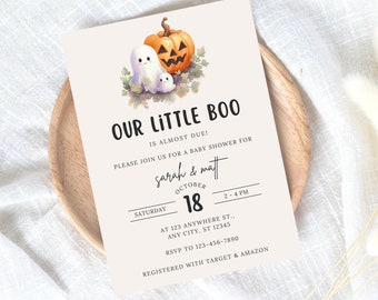 May include: A Halloween-themed baby shower invitation with a cute illustration of a ghost and a pumpkin. The text reads "Our Little Boo is almost due! Please join us for a baby shower for Sarah & Matt, Saturday, October 18, 2-4 PM, at 123 Anywhere St., Any City, ST 12345, RSVP to 123-456-7890, Registered with Target & Amazon."