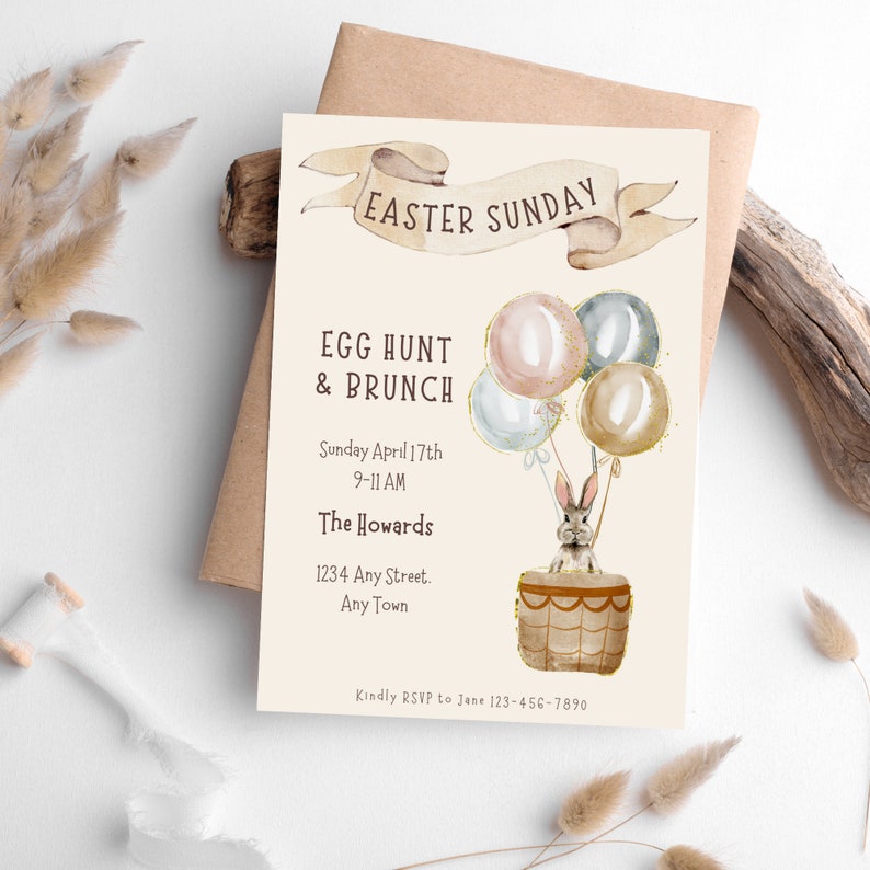 May include: An invitation to an Easter Sunday egg hunt and brunch. The invitation features a watercolor illustration of a bunny in a hot air balloon with pastel colored balloons. The text reads "Easter Sunday", "Egg Hunt & Brunch", "Sunday April 17th 9-11 AM", "The Howards", "1234 Any Street. Any Town", and "Kindly RSVP to Jane 123-456-7890".