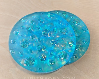 dichroic effect coasters set of 2 iridescent deep turquoise handmade resin art ocean tabletop decor beach house accessories tea drinker gift