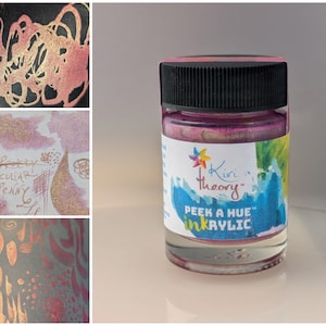 May include: A small glass jar of pink iridescent ink acrylic paint with a black lid. The label reads "Kiri Theory Peek a Hue Inkrylic".