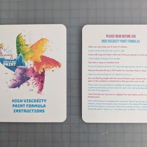 Instruction cards for Kiri Theory High Viscosity formula paint.  One card shows a colorful starburst logo design with the brand name and product name. The other card provides detailed instructions for use which can also be found in the listing description, and which will be included with each order.
