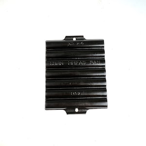 May include: Black cast iron cornbread pan with the text "CORN BREAD PAN" and "No. 64" on the front.