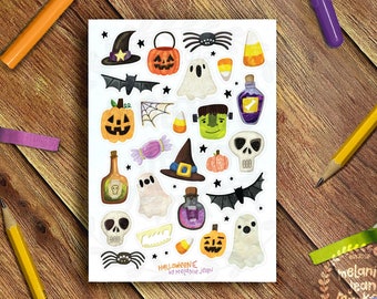 May include: A sheet of Halloween-themed stickers featuring various spooky illustrations. The stickers include pumpkins, ghosts, bats, witch hats, spiders, candy corn, and potion bottles. The text "Halloween by Melanie Jean" is visible.