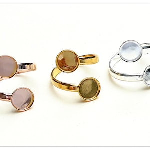 May include: Three adjustable rings with two round, clear, glass-like settings. The rings are available in gold, silver, and rose gold.