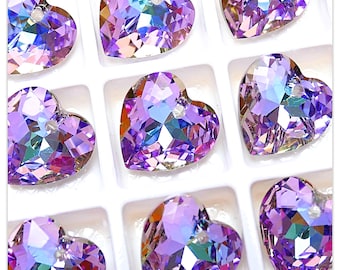 May include: A collection of ten iridescent purple heart-shaped crystal beads with a hole at the top for stringing.