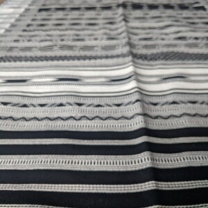 Black and white striped handwoven tribal design rug