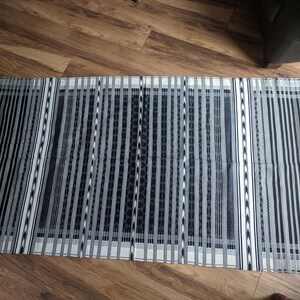Black and white handmade Indian tribal rug with fringe