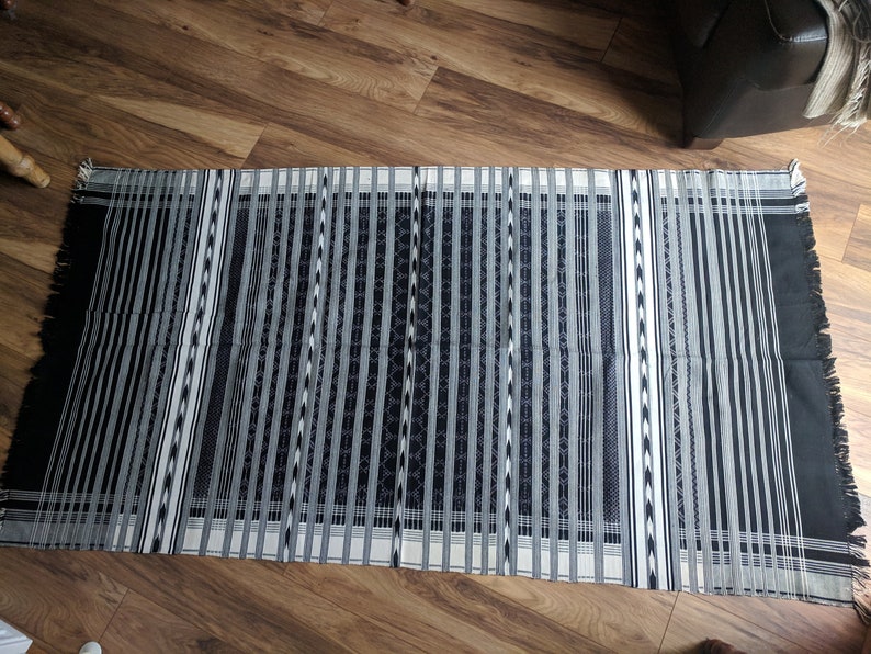 Black and white handmade Indian tribal rug with fringe