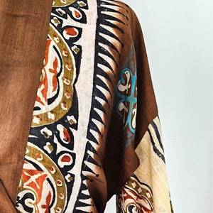 Close up of bold indian tribal print on silk kimono dressing