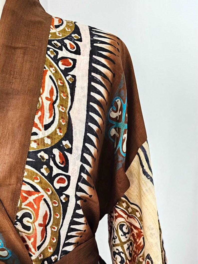 Close up of bold indian tribal print on silk kimono dressing