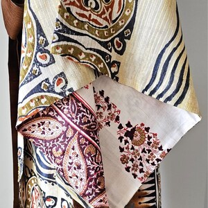 Close up of bold tribal print and pink paisley design on silk kimono sleeves