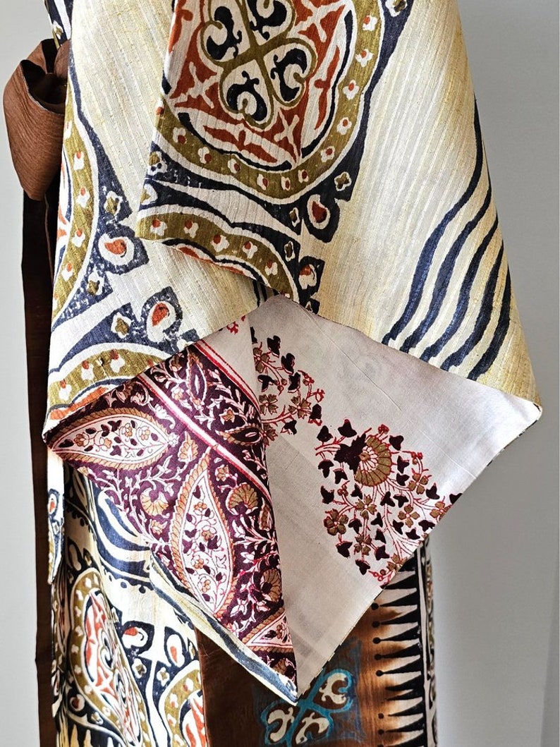 Close up of bold tribal print and pink paisley design on silk kimono sleeves